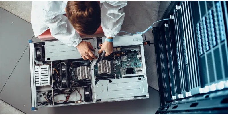 technician providing data center maintenance services on motherboard