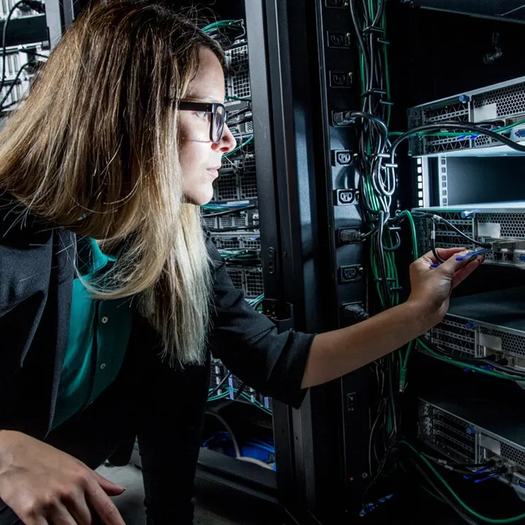 woman from server management company making repair